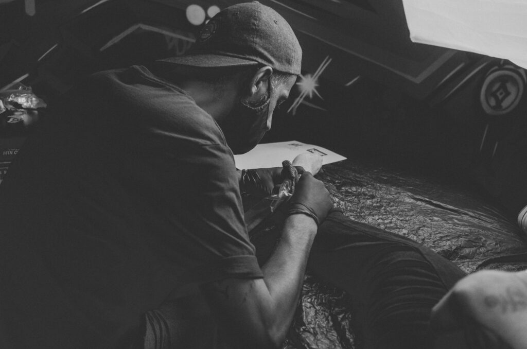 a man in a hat reading a book
